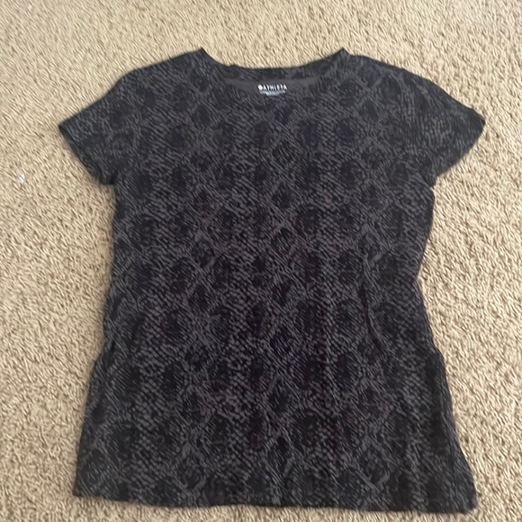 This is an Athleta Shirt. It can be used for exercise and casual wear. - Picture 1 of 3